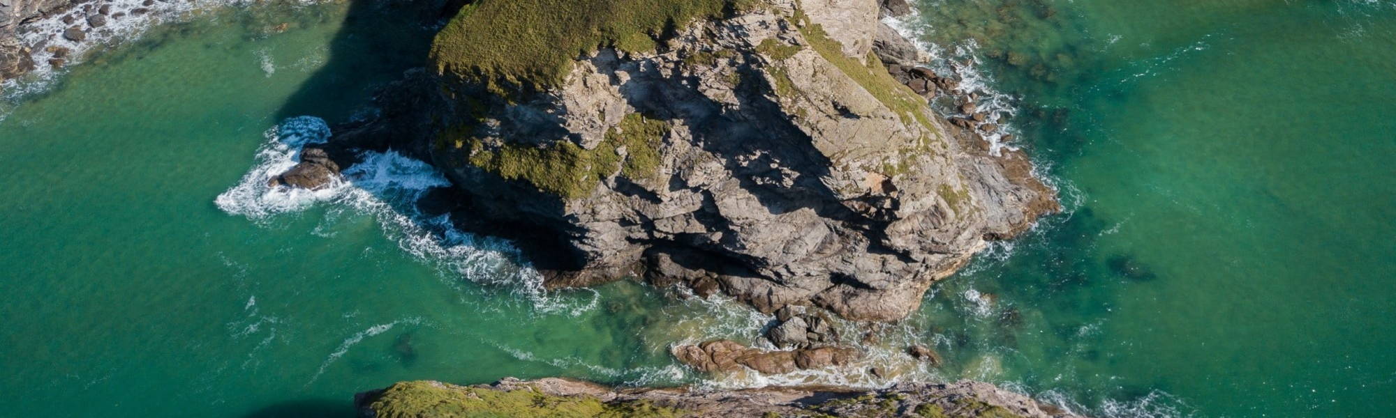 waves crashing on the Cornish coastline, cliffs and ocean 