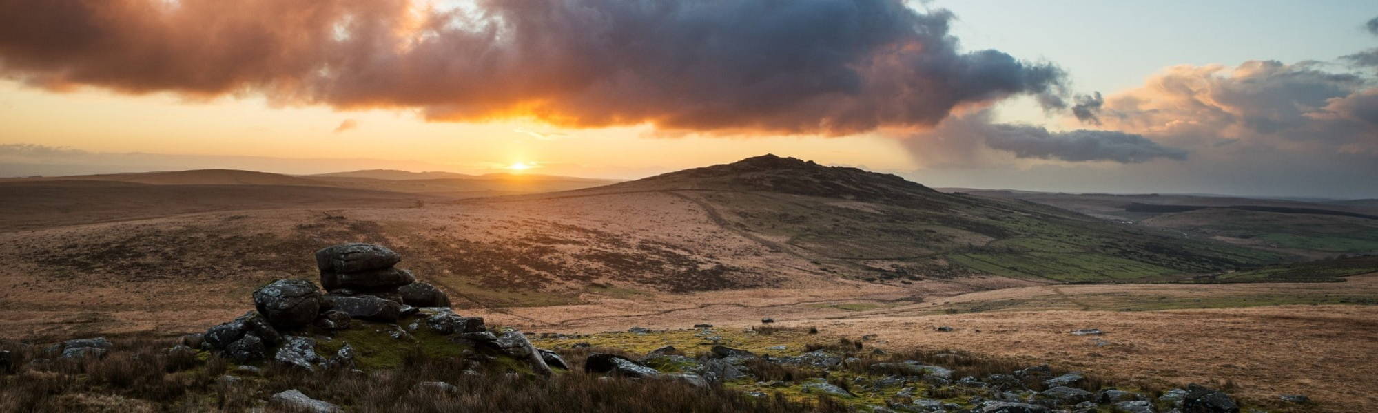 bodmin moor in cornwall, with brown willy and showery tor at sunrise and beautiful cloudy sky