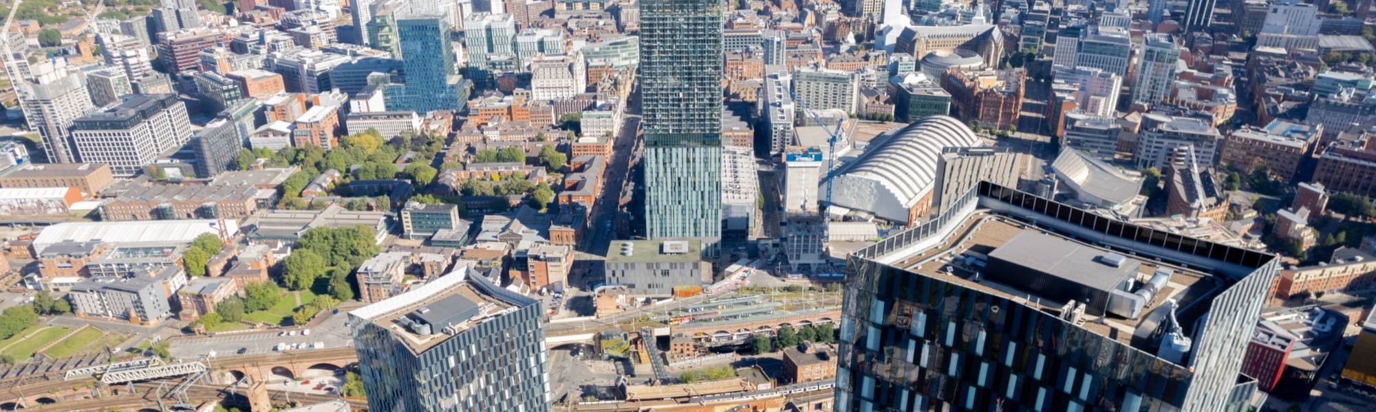 Manchester City Centre Drone Aerial View Above Building Work Skyline Construction Blue Sky Summer Beetham Tower Deansgate Square Glass Towers.