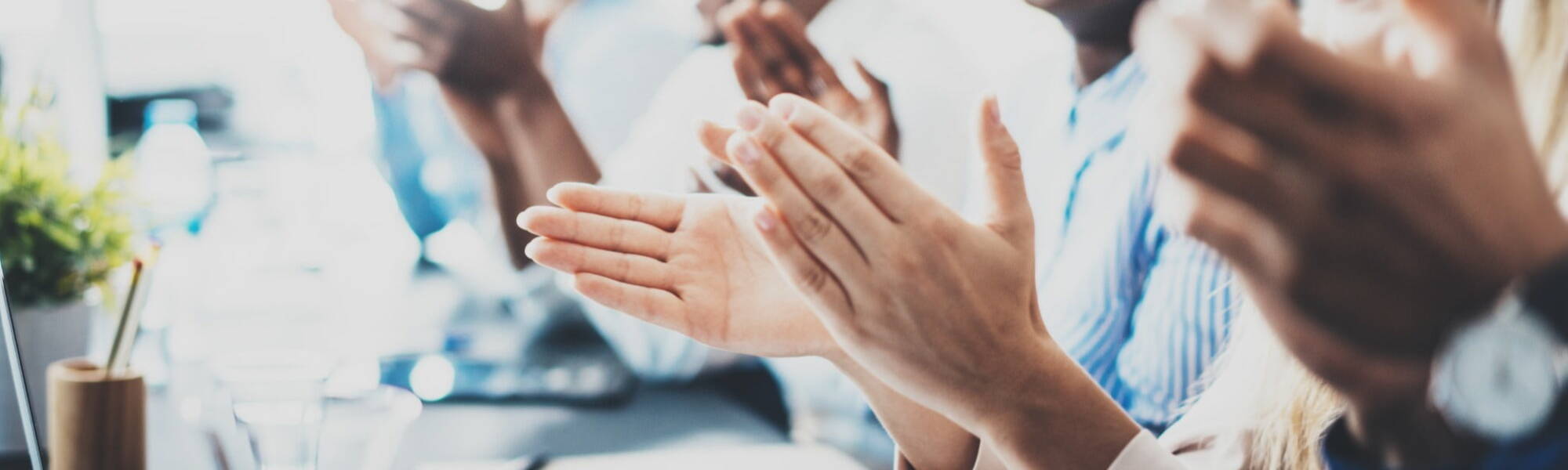 office workers hands clapping